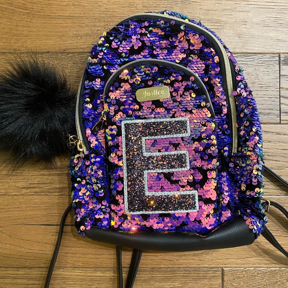 JUSTICE sequin mini backpack with letter “E”.